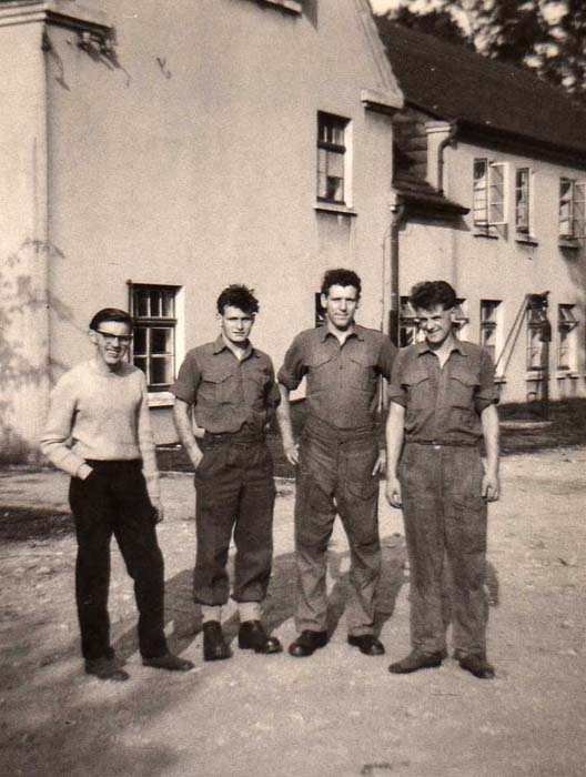 Fusiliers Terry Wilding, Fus Brown, Fus Eddleston and Fus 'Solford City II' outside the farmhouse used as a billet before digging in the OPs on the Mittland Canal for Operation Spearpoint'
