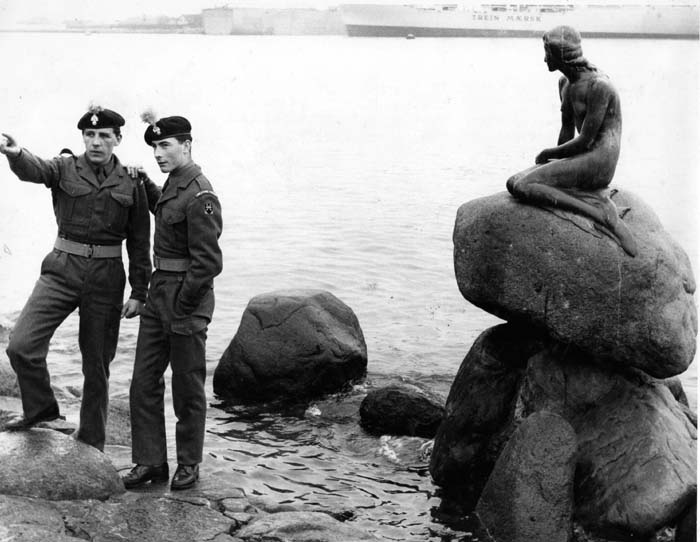 Fus Bill Chapman (from Moss Side,Manchester) pointing and Fus 'Rosie' Rose in Copenhagen by the Little Mermaid taken on rest & recuperation after the scheme against the Danish army in November 1961