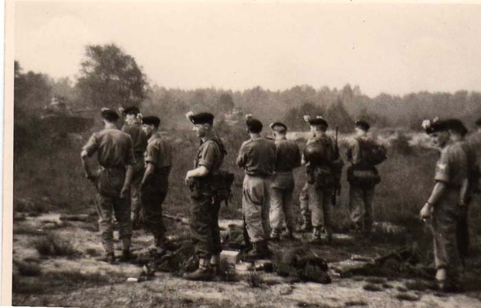 D Coy waiting for American 3rd Armoured Div tanks to pass before moving out on Luneberg Heath during training for NATO scheme in Oct 1961to be held later in November named 'Operation Spearpoint'