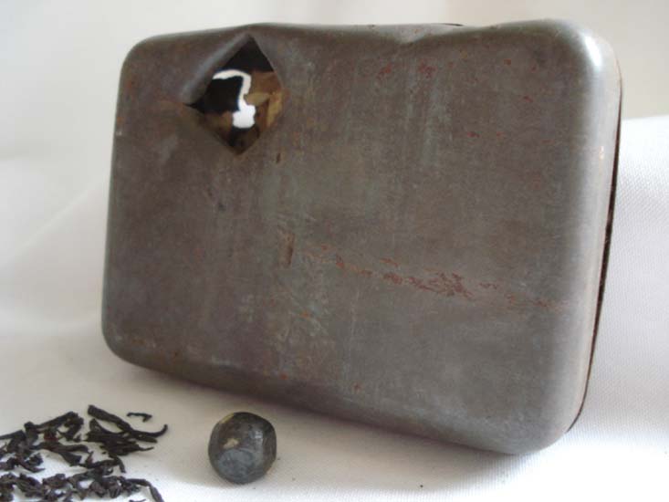 Alfred White's Tea Tin showing the bullet